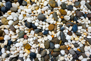 Sea pebbles. Small stones gravel texture background.Pile of pebbles, thailand.Color stone in background. 