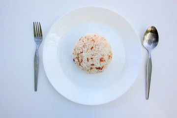 Clean food have brown rice in white disc on white background, healthy food concept Top view. 