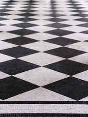 Black and white checkered marble floor pattern