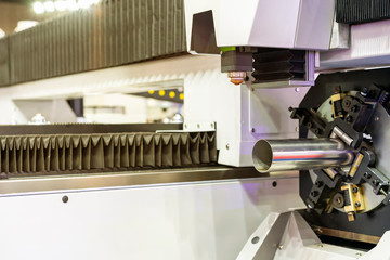 close up pipe product prepare or setting by clamp with automatic feed and rotate unit of  high precision & accuracy cnc plasma laser cutting machine for engrave or perforate in factory or work shop