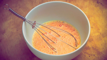 Whisking eggs in the bowl