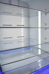 Inside of empty and clean modern refrigerator