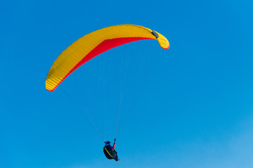 Paragliding in the sky.paraglider fly over the mountain valley. Competitions with paragliding, Russia, Siberia