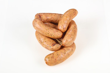 Tasty meat sausages over white background
