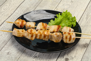 Grilled pork skewer served salad