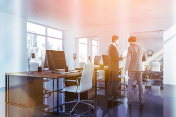 Businessmen in white open space office