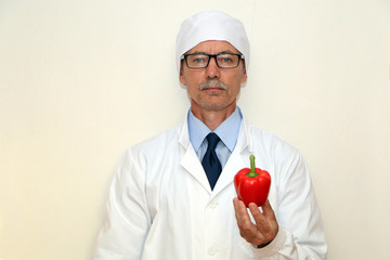 Healthy Eating - Doctor holds vegetables and fruits