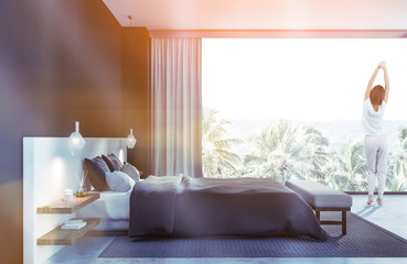 Woman in panoramic bedroom interior