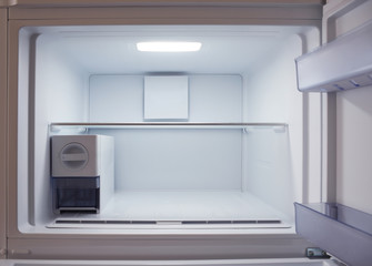 Fototapeta premium Inside of empty and clean modern refrigerator