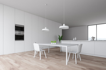 White minimalist kitchen corner with countertops