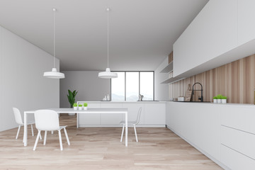White and wood kitchen interior, counter and table