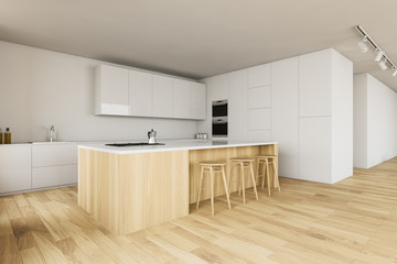White kitchen corner with bar and stools