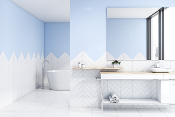 Naklejka na ściany i meble White and blue bathroom with sink and tub