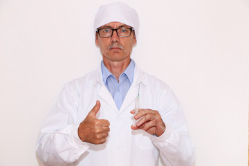 Health - Doctor holds a syringe for vaccination