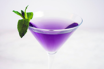 Purple Cocktail with Mint Garnish