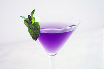 Purple Cocktail with Mint Garnish