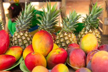 Street stall with pineapples and mangoes