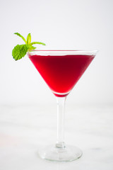 Red Cocktail with Mint Garnish