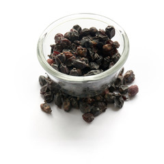 dried isolated barberry in a glass plate