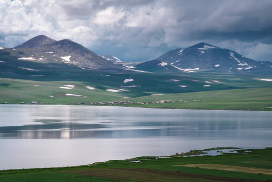 Lake Paravani in Georgia, Caucasus. The largest lake in Georgia at an altitude of more than 2000 meters. Low rain clouds.