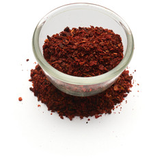 crushed dried tomato isolated a glass plate