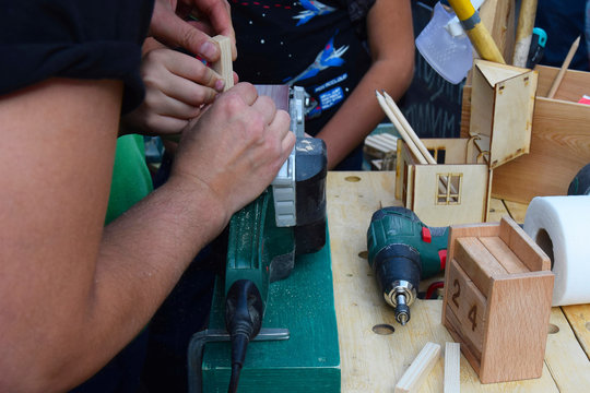 Master class in carpentry training. Tools and carpenter's hands. Carpenter working. Workshop.