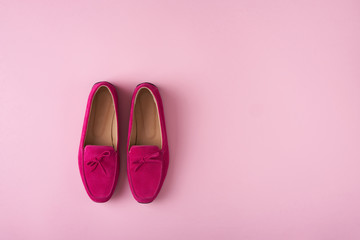 Bright Raspberry clolor suede moccasins shoes over pink background