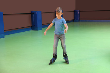 Boy having fun at roller skating rink