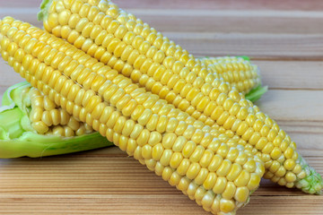 sweet corn on wooden background
