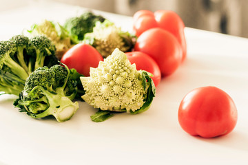 Vegetable variety on wooden white table. Selection of summer and autumn vegetables, space for text.