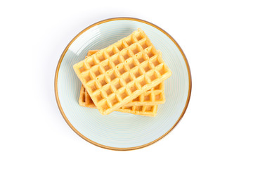 Belgian waffles on plate isolated on white background