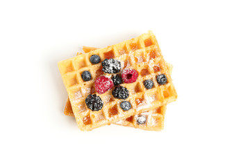 Belgian waffles with caramel topping isolated on white background
