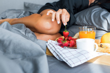 Breakfast bed for holiday young beautiful brunette