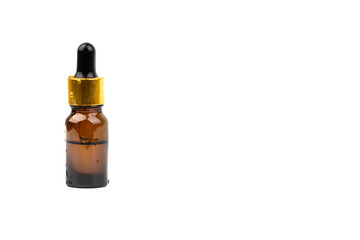 Dropper serum and brown glass bottle isolated on white background. Skin care, drug and cosmetic concept