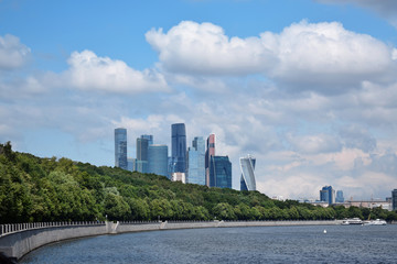 Obraz premium Moscow, Russia - July 8, 2019: The view of the Moscow International Business Center skyscrapers and cloudy sky from the Vorobyevskaya embankment