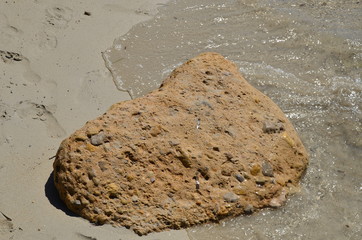 stone in sand