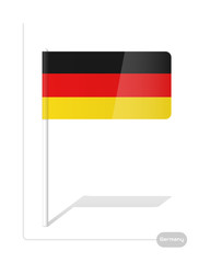 The German plastic flag it is fastened on a white plastic stick the one is isolated on a white background.