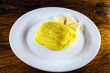 Pamonha, Brazilian sweet corn with cheese filling. Pamonha typical of Brazil, food of the state of minas gerais and goiais. Concept of traditional food. Brazilian food at rural parties