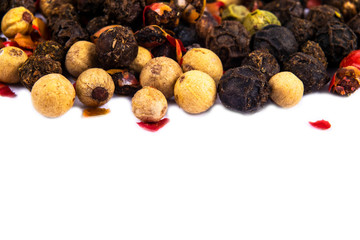 Colored dried pepper mix on. Red, black, white and green pepper close up.  Top view. Texture of...