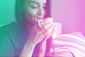 Young beautiful happy brunette woman in black silk