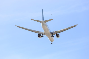 commercial airliner flying overhead