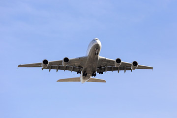 Fototapeta na wymiar commercial airliner flying overhead