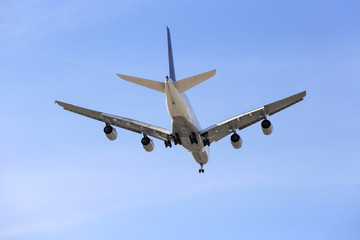 Fototapeta na wymiar commercial airliner flying overhead