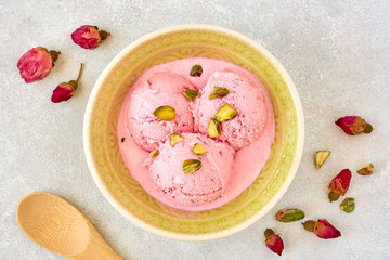 Strawberry rosewater ice cream , frozen yogurt with pistachio and rosebud. Top view