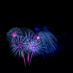 Beautiful colorful isolated firework display for celebration happy new year and merry christmas on black background