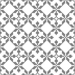 Cross-stitch, embroidery. Black and white seamless decorative pattern. Ornamented background for wallpaper, textile.