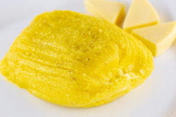pamonha, Brazilian sweet made from homemade cheese with corn. Open pissing ready for consumption. Concept of traditional Brazilian sweet, typical food of the months of June and July.