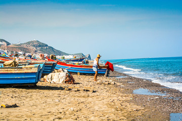 Fototapeta na wymiar Oued Laou, Morocco - October 19, 2013. Fishermen boat on the shore of Mediterranean Sea