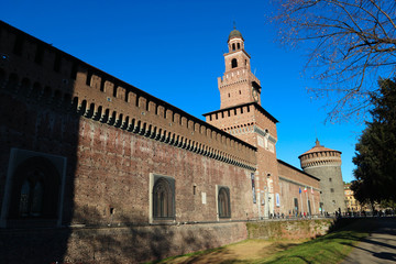 Fototapeta na wymiar View to famous Milan landmark Sforza castle towers and wall in bright sunny winter day
