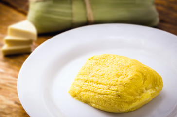 pamonha, Brazilian sweet made from homemade cheese with corn. Open pissing ready for consumption. Concept of traditional Brazilian sweet, typical food of the months of June and July.